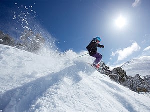 skiing on the snowy mountains